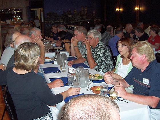 Bruce Melberg (hand on face) visits with Terry Kreutzer, Dan and Sue Booe, and Rich Murrish.